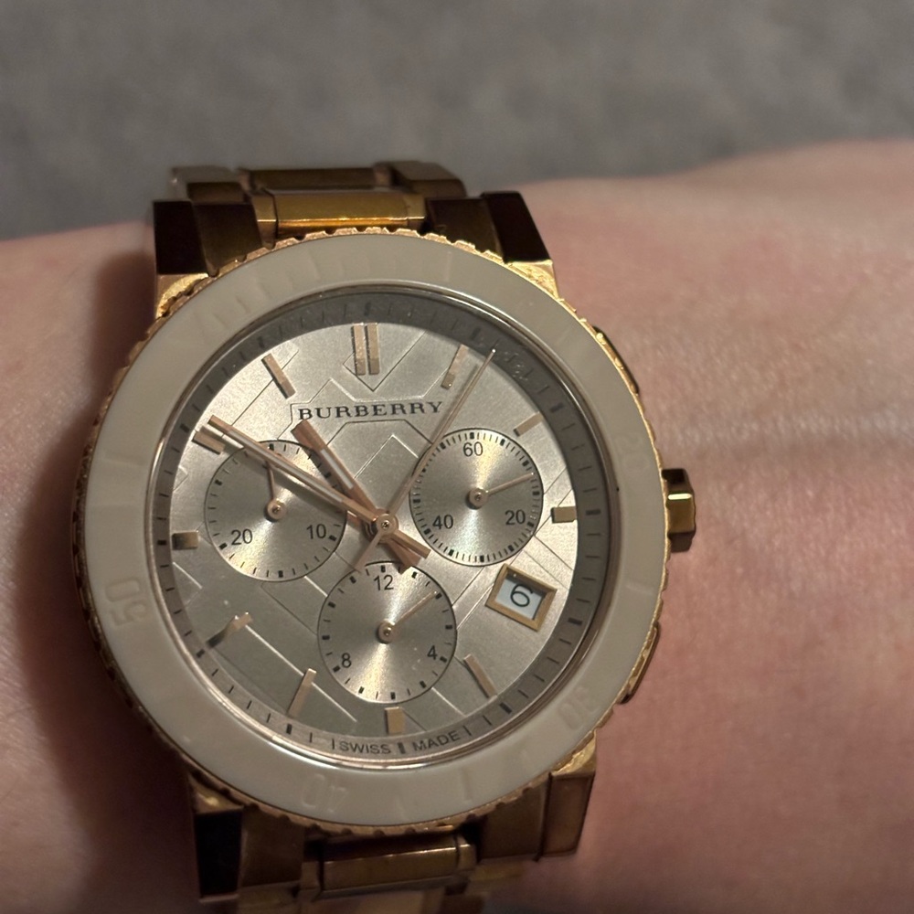 Women’s Burberry watch, rose gold hardware.